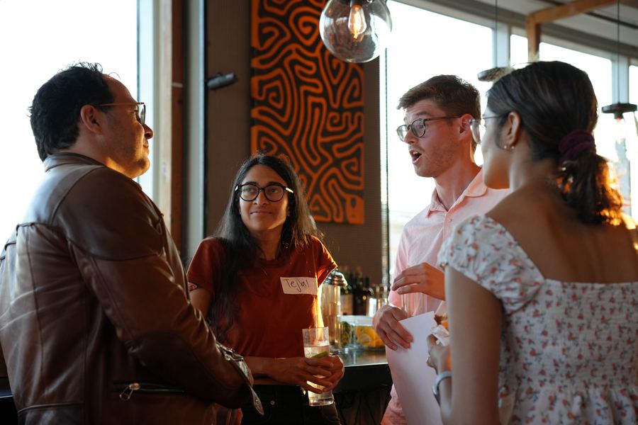 Event photography - rooftop networking event at golden hour