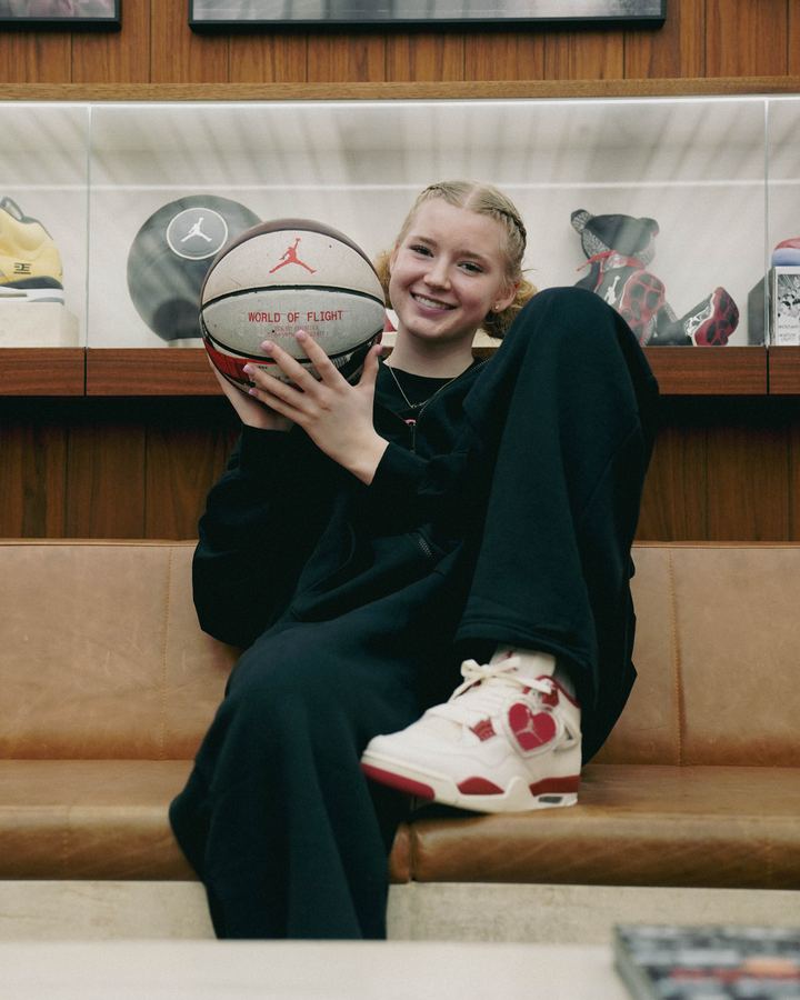 Nike - Air Jordan 4s in foreground with athlete behind